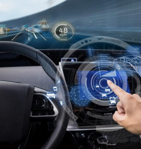 A hand uses a holographic car dashboard display showing speed, navigation, and nearby vehicles.