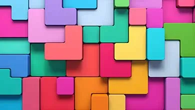 A tessellated grid of colorful, interlocking 3D L-shaped blocks in bright pink, cyan, purple, green, yellow, orange, and red, resembling Tetris pieces.