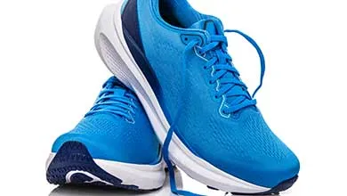 Pair of blue running shoes on a white background